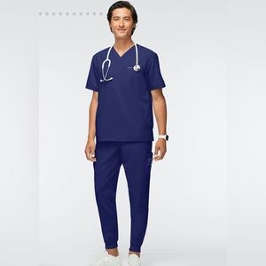 NWT. Brand new never worn sz M Jaanuu scrub set in Navy